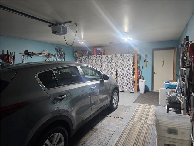 318 Frenette Dr Unit 2, Chippewa Falls, WI 54729 - garage with a garage door opener