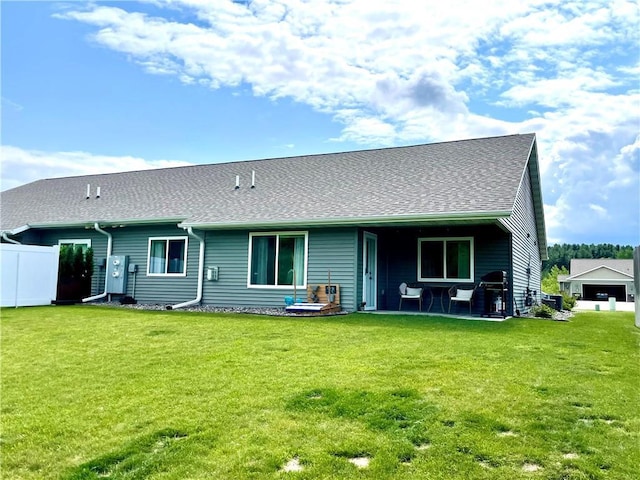 4010 Nicholas Dr, Menomonie, WI 54751 - rear view of property featuring a patio and a shingled roof