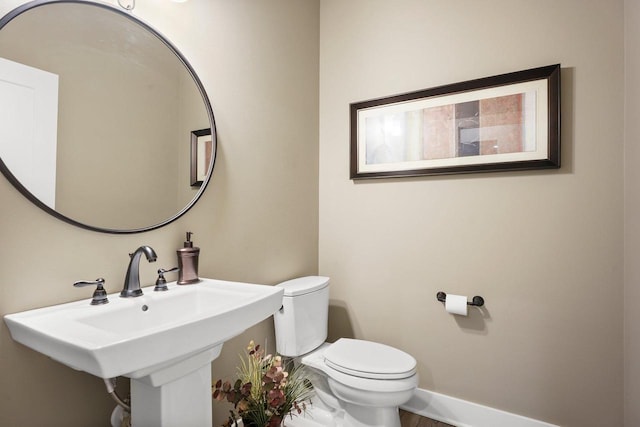 6249 Fountainhead Cir, Deforest, WI 53532 - half bath with toilet, a sink, and baseboards