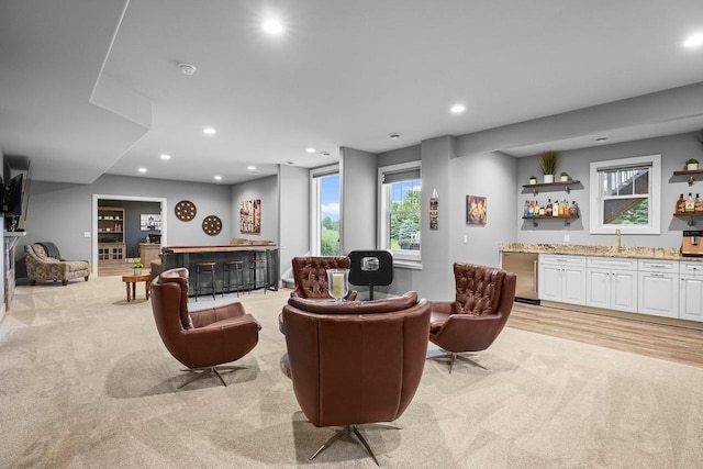 6249 Fountainhead Cir, Deforest, WI 53532 - living area featuring wet bar, light carpet, and recessed lighting