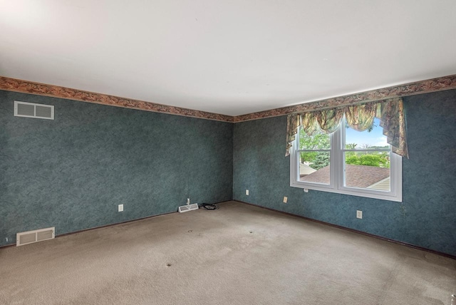 6262 W College Ave, Greendale, WI 53129 - spare room featuring carpet floors and wallpapered walls