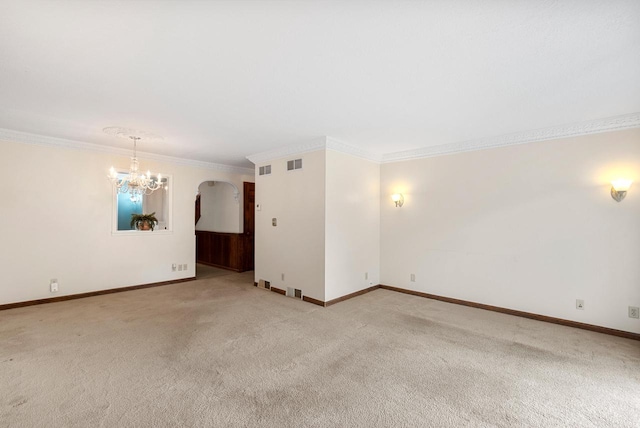 6262 W College Ave, Greendale, WI 53129 - carpeted empty room with a chandelier, ornamental molding, baseboards, and arched walkways