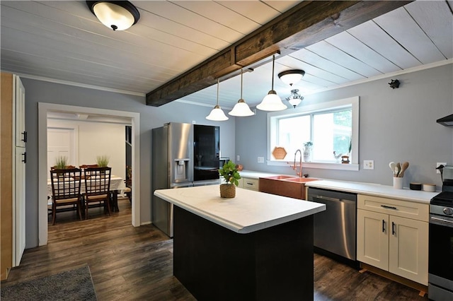 54675 Cudworth Ave, Grand View, WI 54839 - kitchen featuring appliances with stainless steel finishes, a sink, light countertops, a center island, and white cabinetry