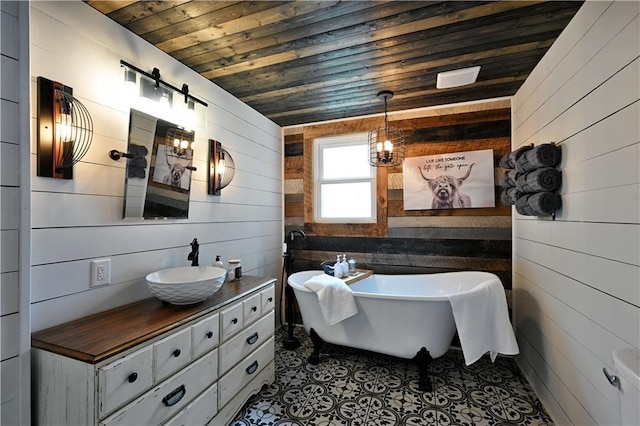 54675 Cudworth Ave, Grand View, WI 54839 - full bath with wood ceiling, wood walls, vanity, and a freestanding tub