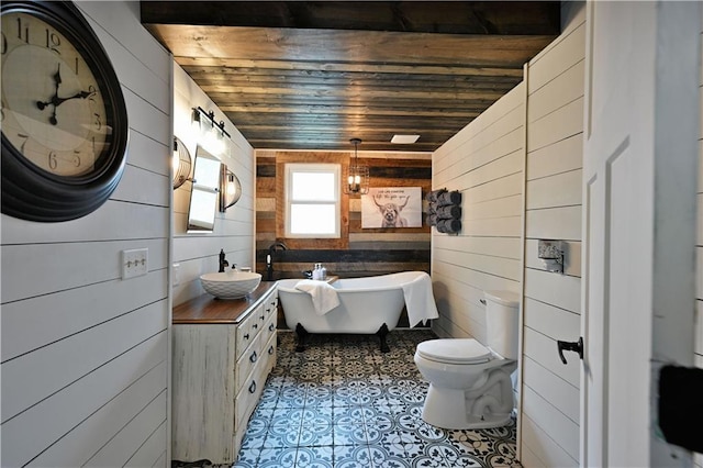 54675 Cudworth Ave, Grand View, WI 54839 - full bath with wood walls, a freestanding bath, wooden ceiling, toilet, and vanity
