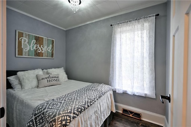 54675 Cudworth Ave, Grand View, WI 54839 - bedroom with ornamental molding, baseboards, and wood finished floors
