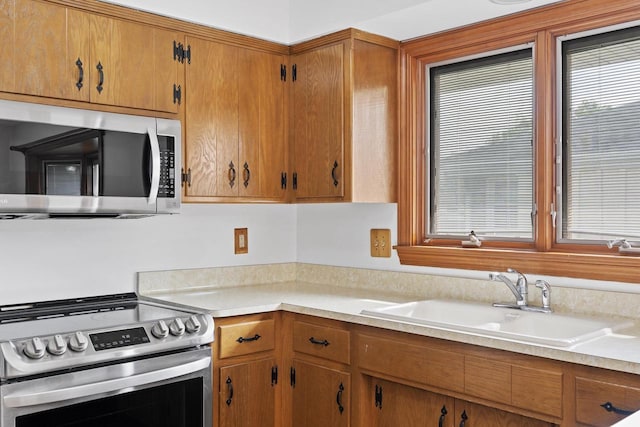 1615 Hickory St, South Milwaukee, WI 53172 - kitchen with stainless steel appliances, light countertops, and healthy amount of natural light