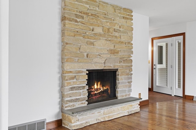 1615 Hickory St, South Milwaukee, WI 53172 - detailed view of a stone fireplace and wood finished floors