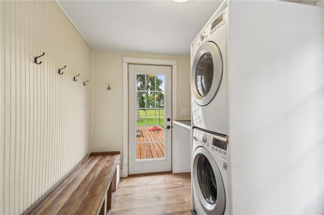 2256 40th Ave Unit X, Osceola, WI 54020 - laundry area with stacked washing machine and dryer and light wood-style flooring