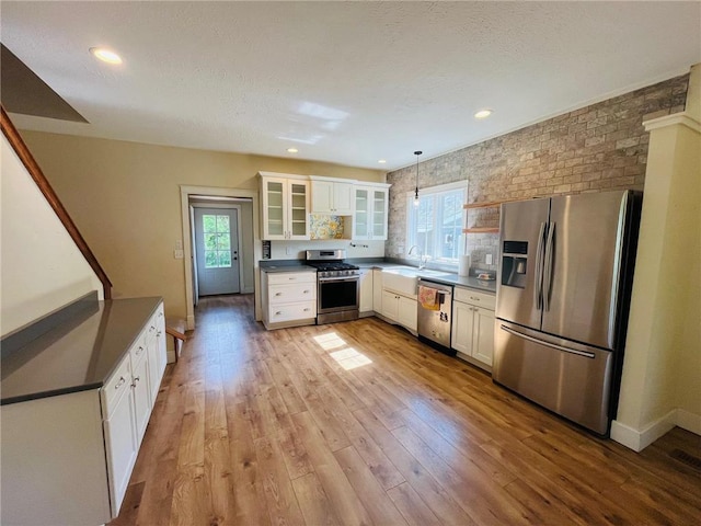 2256 40th Ave Unit X, Osceola, WI 54020 - kitchen with stainless steel appliances, dark countertops, plenty of natural light, and recessed lighting