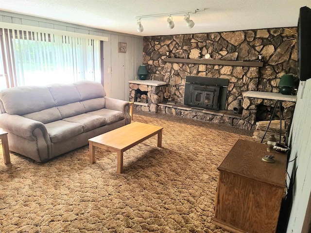 W5677 Alice Ln, New Lisbon, WI 53950 - living area featuring a stone fireplace and track lighting