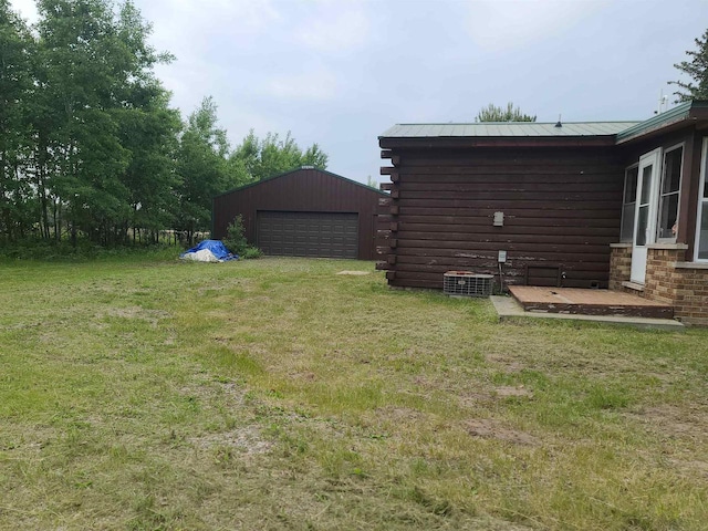 W5677 Alice Ln, New Lisbon, WI 53950 - view of grassy yard featuring a detached garage and an outbuilding