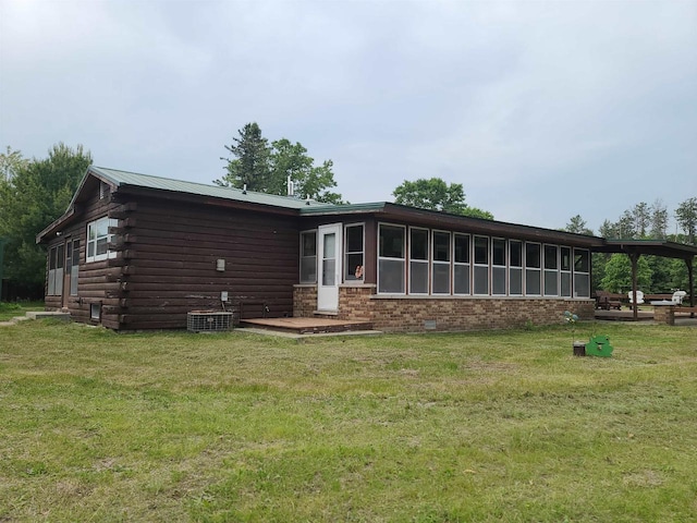 W5677 Alice Ln, New Lisbon, WI 53950 - back of house featuring a yard and log siding