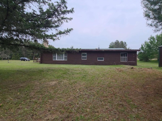 W5677 Alice Ln, New Lisbon, WI 53950 - view of property exterior with a chimney and a yard