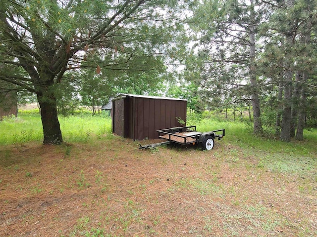 W5677 Alice Ln, New Lisbon, WI 53950 - view of yard featuring a storage shed