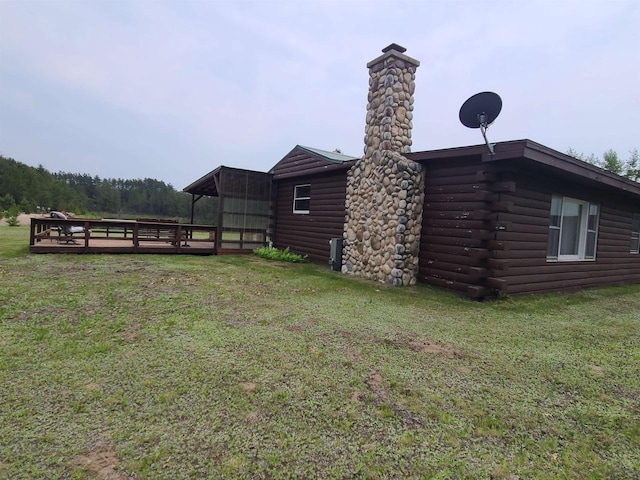 W5677 Alice Ln, New Lisbon, WI 53950 - view of green lawn featuring a deck