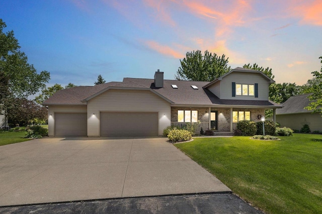 N7844 Lake Shore Ln, Sherwood, WI 54169 - traditional home with an attached garage, concrete driveway, a yard, covered porch, and a chimney
