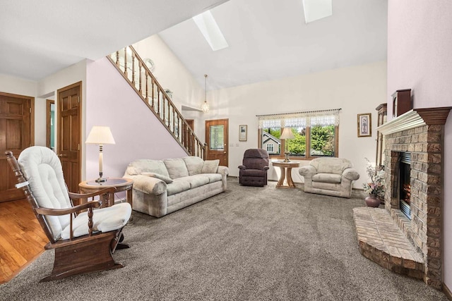 N7844 Lake Shore Ln, Sherwood, WI 54169 - living room with stairs, a brick fireplace, high vaulted ceiling, a skylight, and carpet