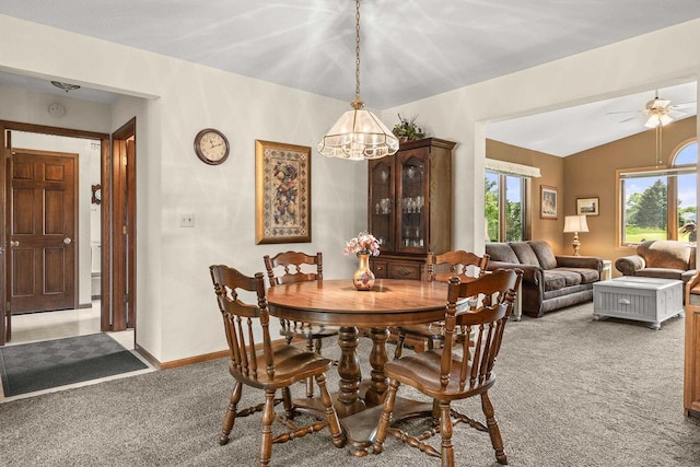 N7844 Lake Shore Ln, Sherwood, WI 54169 - carpeted dining area featuring a chandelier, vaulted ceiling, a ceiling fan, and baseboards