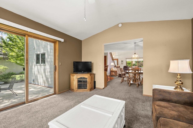 N7844 Lake Shore Ln, Sherwood, WI 54169 - carpeted living room featuring vaulted ceiling, plenty of natural light, and baseboards