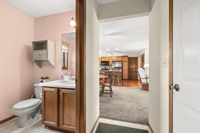 N7844 Lake Shore Ln, Sherwood, WI 54169 - half bath with vanity, toilet, and baseboards