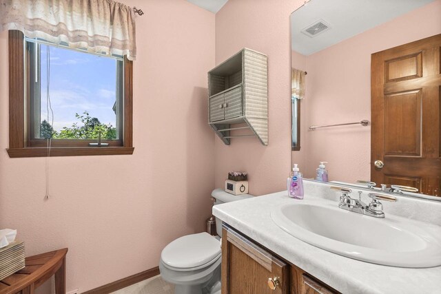 N7844 Lake Shore Ln, Sherwood, WI 54169 - bathroom featuring vanity, toilet, and baseboards