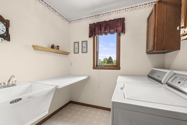 N7844 Lake Shore Ln, Sherwood, WI 54169 - washroom featuring cabinet space, washing machine and clothes dryer, and baseboards