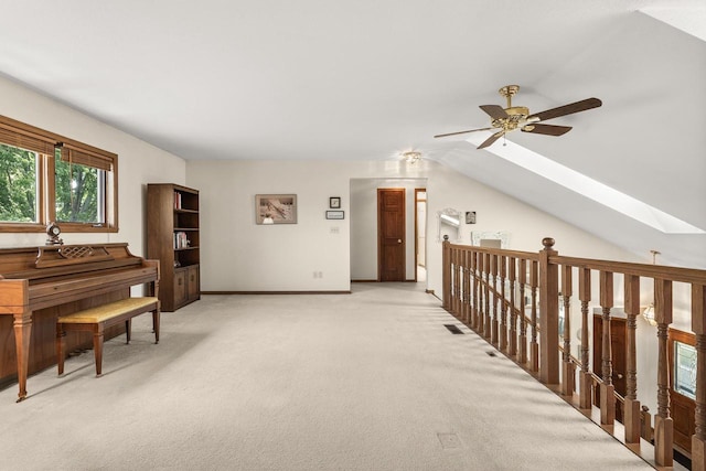 N7844 Lake Shore Ln, Sherwood, WI 54169 - sitting room with a skylight, light colored carpet, a ceiling fan, an upstairs landing, and vaulted ceiling