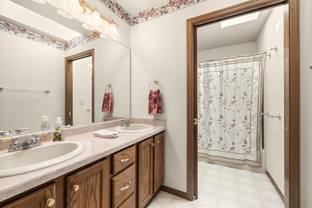 N7844 Lake Shore Ln, Sherwood, WI 54169 - bathroom with double vanity, tile patterned floors, and baseboards