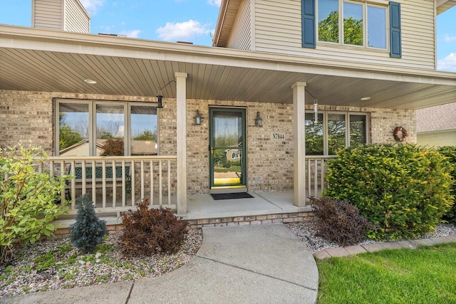 N7844 Lake Shore Ln, Sherwood, WI 54169 - view of exterior entry with covered porch and brick siding