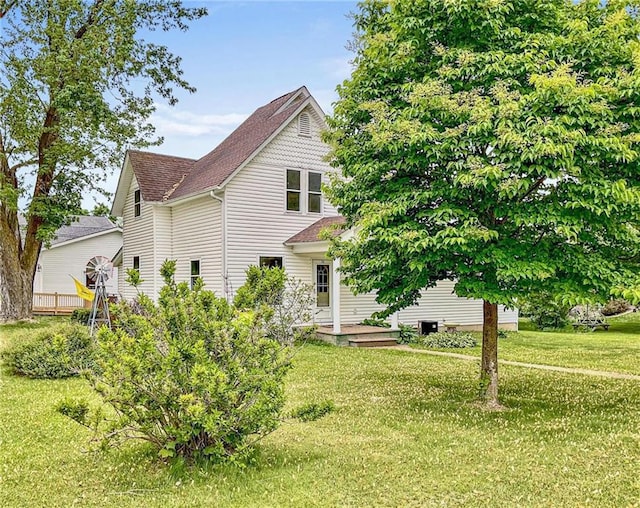 231 S Woodworth St, Elmwood, WI 54740 - view of front of house featuring a shingled roof and a front lawn