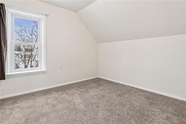 231 S Woodworth St, Elmwood, WI 54740 - bonus room with healthy amount of natural light, carpet, lofted ceiling, and baseboards