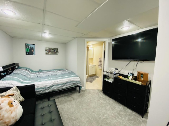 540 W Manor Cir, Bayside, WI 53217 - bedroom with light carpet, ensuite bath, and a drop ceiling