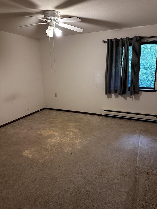 5313 Brody Dr Unit 202, Madison, WI 53705 - unfurnished room with a baseboard heating unit, a ceiling fan, carpet floors, and baseboards