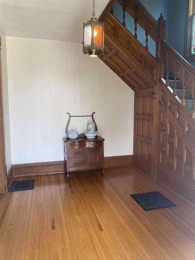 352 N Harrison St, Lancaster, WI 53813 - entryway featuring wallpapered walls and hardwood / wood-style floors