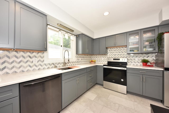 7062 N 46th St, Milwaukee, WI 53223 - kitchen featuring stainless steel appliances, light countertops, gray cabinets, and recessed lighting