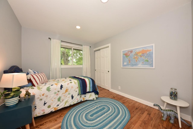 7062 N 46th St, Milwaukee, WI 53223 - bedroom featuring wood finished floors, a closet, and recessed lighting