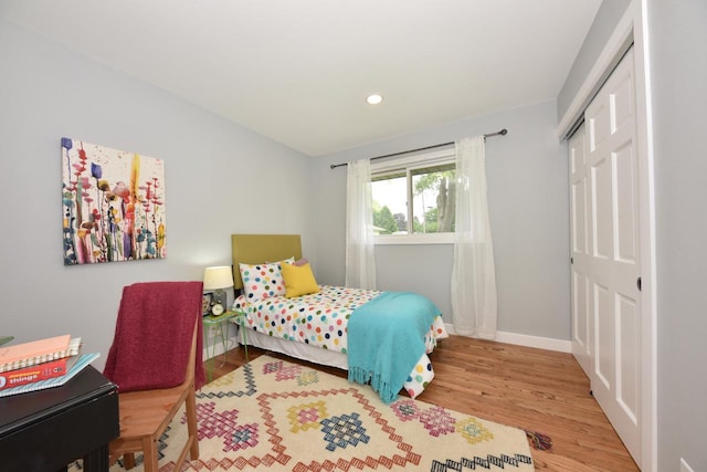 7062 N 46th St, Milwaukee, WI 53223 - bedroom featuring a closet, wood finished floors, and recessed lighting