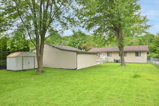 7062 N 46th St, Milwaukee, WI 53223 - fenced backyard featuring a storage shed and view of scattered trees