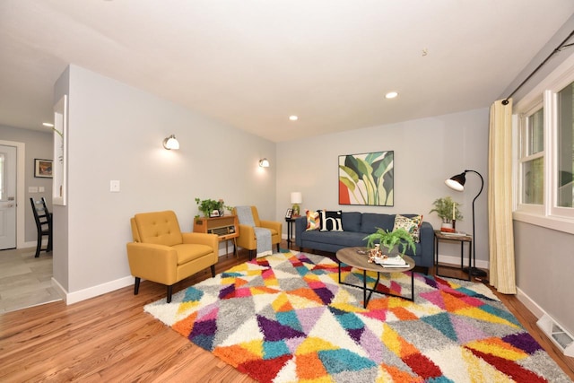 7062 N 46th St, Milwaukee, WI 53223 - living room with light wood finished floors and recessed lighting
