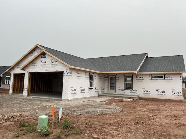 W5808 Delta Dr, Menasha, WI 54952 - property under construction with a garage and a porch