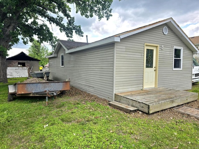 422 Wyota Ave, East Dubuque, IL 61025 - back of house featuring a deck and a lawn