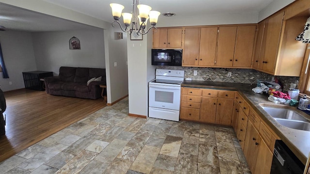 510 N Monroe St, Lancaster, WI 53813 - kitchen with black appliances, a sink, tasteful backsplash, and light stone finish flooring