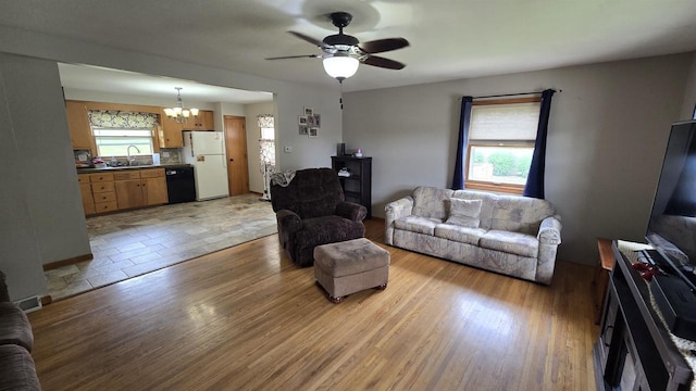 510 N Monroe St, Lancaster, WI 53813 - living area with a chandelier, light wood finished floors, and a ceiling fan