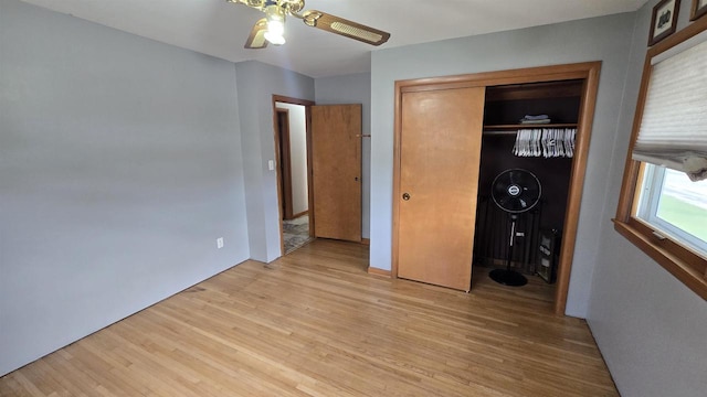 510 N Monroe St, Lancaster, WI 53813 - bedroom with light wood-style flooring, a closet, and ceiling fan