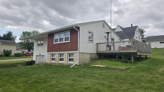 510 N Monroe St, Lancaster, WI 53813 - rear view of property featuring a wooden deck and a lawn