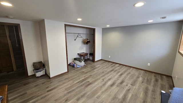 510 N Monroe St, Lancaster, WI 53813 - unfurnished bedroom with recessed lighting, baseboards, wood finished floors, and a closet