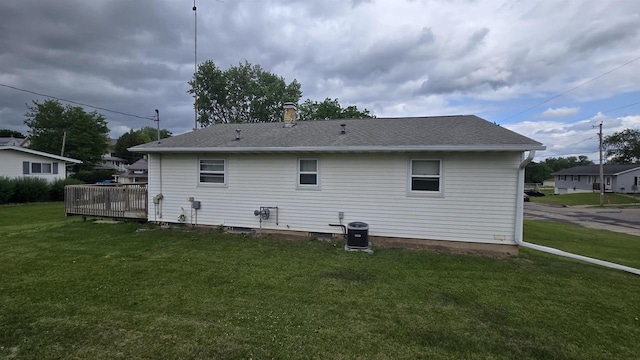 510 N Monroe St, Lancaster, WI 53813 - rear view of house featuring a yard, a deck, central AC, and a shingled roof