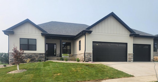 1100 Moll Dr, Waunakee, WI 53597 - view of front of property featuring board and batten siding, a garage, and stone siding