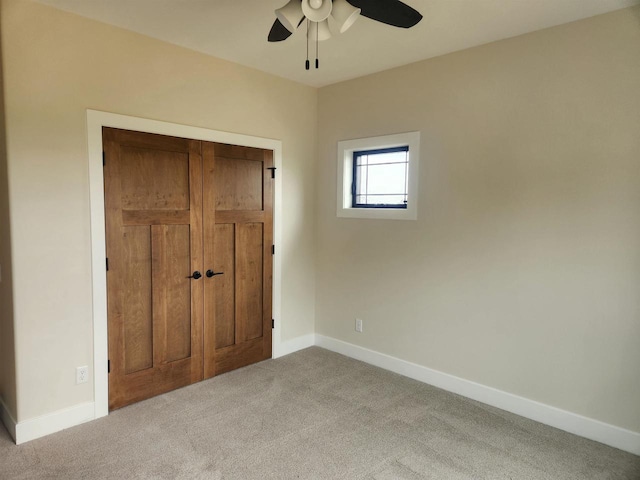 1100 Moll Dr, Waunakee, WI 53597 - unfurnished bedroom featuring carpet flooring, baseboards, and ceiling fan